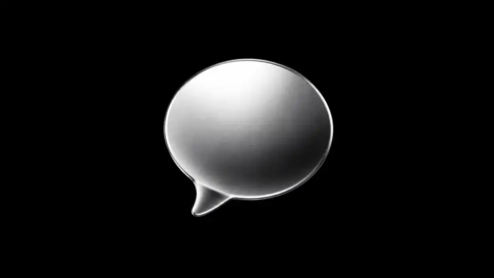 Metallic chat bubble on a black background